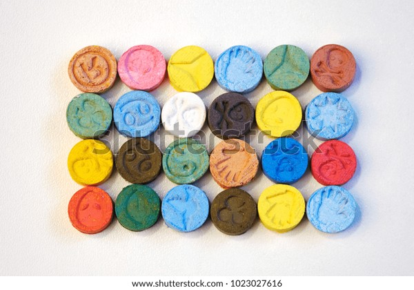 several-pills-mdma-extasy-on-600w-1023027616.jpg